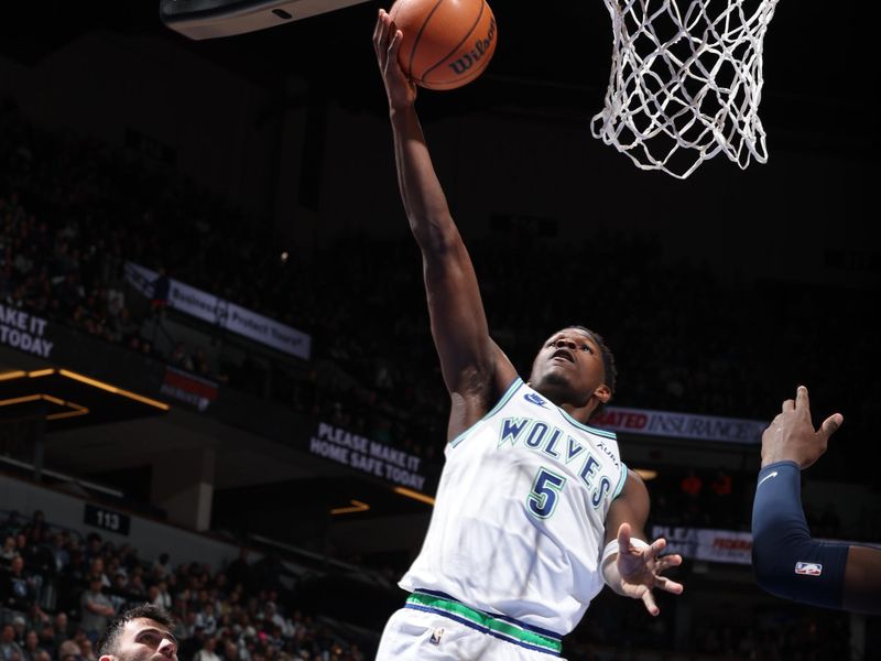 MINNEAPOLIS, MN -  JANUARY 18: Anthony Edwards #5 of the Minnesota Timberwolves drives to the basket during the game against the Memphis Grizzlies on January 18, 2024 at Target Center in Minneapolis, Minnesota. NOTE TO USER: User expressly acknowledges and agrees that, by downloading and or using this Photograph, user is consenting to the terms and conditions of the Getty Images License Agreement. Mandatory Copyright Notice: Copyright 2024 NBAE (Photo by David Sherman/NBAE via Getty Images)