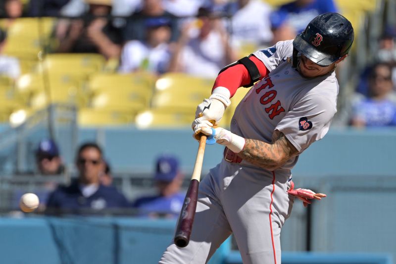 Jul 20, 2024; Los Angeles, California, USA;  Boston Red Sox left fielder Jarren Duran (16) singles in the first inning against the Los Angeles Dodgers at Dodger Stadium. Mandatory Credit: Jayne Kamin-Oncea-USA TODAY Sports