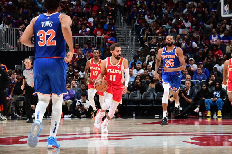 ATLANTA, GA - NOVEMBER 6: Trae Young #11 of the Atlanta Hawks dribbles the ball during the game against the New York Knicks during a regular season game on November 6, 2024 at State Farm Arena in Atlanta, Georgia.  NOTE TO USER: User expressly acknowledges and agrees that, by downloading and/or using this Photograph, user is consenting to the terms and conditions of the Getty Images License Agreement. Mandatory Copyright Notice: Copyright 2024 NBAE (Photo by Scott Cunningham/NBAE via Getty Images)