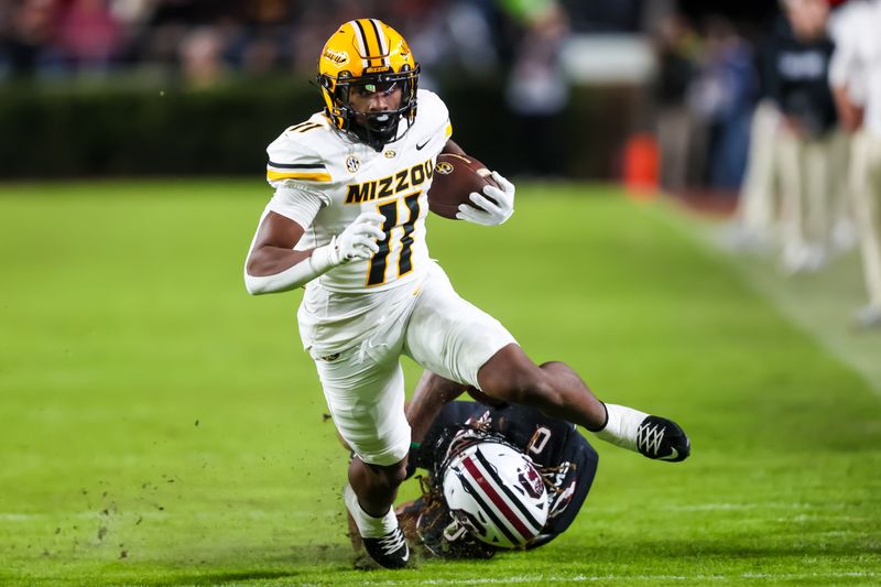 Nov 16, 2024; Columbia, South Carolina, USA; Missouri Tigers running back Kewan Lacy (11) runs the ball against the South Carolina Gamecocks in the second half at Williams-Brice Stadium. Mandatory Credit: Jeff Blake-Imagn Images