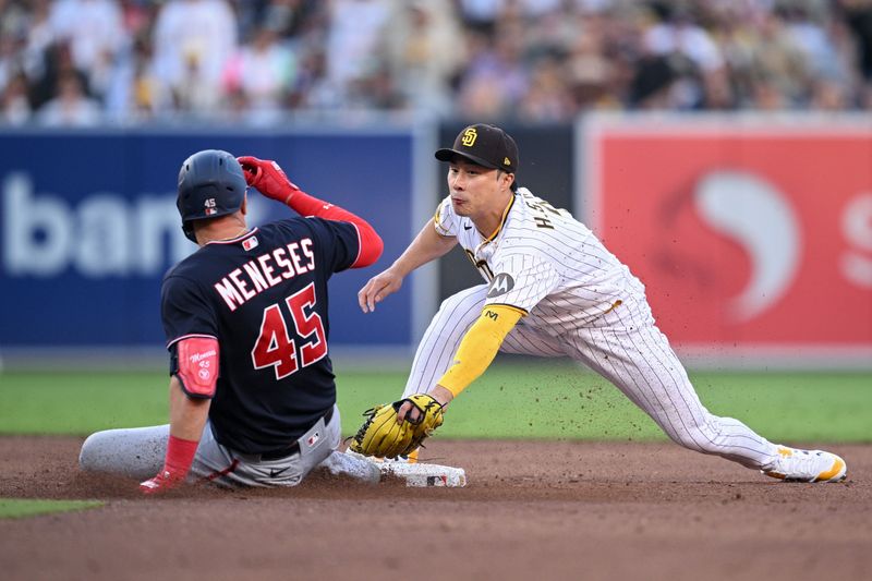 Jun 24, 2023; San Diego, California, USA; San Diego Padres second baseman Ha-seong Kim (right) tags out Washington Nationals designated hitter Joey Meneses (45) at second base during the sixth inning at Petco Park. Mandatory Credit: Orlando Ramirez-USA TODAY Sports