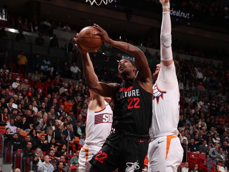 MIAMI, FL - JANUARY 29: Jimmy Butler #22 of the Miami Heat drives to the basket during the game against the Phoenix Suns on January 29, 2024 at Kaseya Center in Miami, Florida. NOTE TO USER: User expressly acknowledges and agrees that, by downloading and or using this Photograph, user is consenting to the terms and conditions of the Getty Images License Agreement. Mandatory Copyright Notice: Copyright 2024 NBAE (Photo by Issac Baldizon/NBAE via Getty Images)