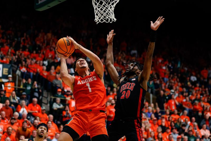 Jan 19, 2024; Fort Collins, Colorado, USA; Colorado State Rams forward Joel Scott (1) drives to the net against UNLV Rebels forward Keylan Boone (20) in the second half at Moby Arena. Mandatory Credit: Isaiah J. Downing-USA TODAY Sports