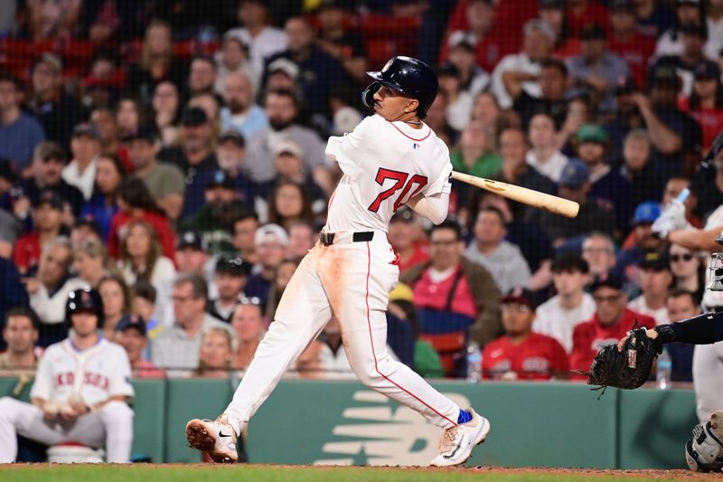 Jun 16, 2024; Boston, Massachusetts, USA; Boston Red Sox shortstop David Hamilton (70) hits an RBI single against the New York Yankees during the eighth inning at Fenway Park. Mandatory Credit: Eric Canha-USA TODAY Sports