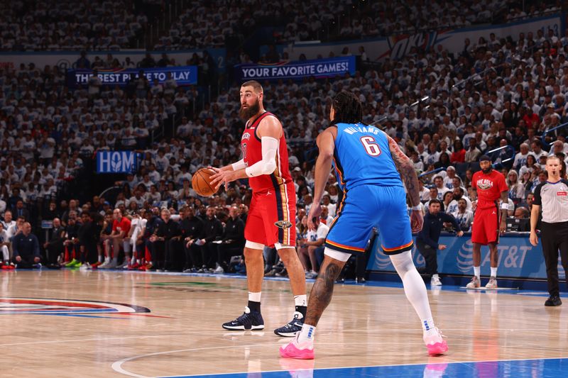 OKLAHOMA CITY, OK - APRIL 24: Jonas Valanciunas #17 of the New Orleans Pelicans dribbles the ball during the game against the Oklahoma City Thunder during Round 1 Game 2 of the 2024 NBA Playoffs on April 24, 2024 at Paycom Arena in Oklahoma City, Oklahoma. NOTE TO USER: User expressly acknowledges and agrees that, by downloading and or using this photograph, User is consenting to the terms and conditions of the Getty Images License Agreement. Mandatory Copyright Notice: Copyright 2024 NBAE (Photo by Zach Beeker/NBAE via Getty Images)