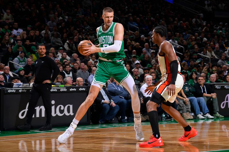 BOSTON, MA - DECEMBER 4: Kristaps Porzingis #8 of the Boston Celtics handles the ball during the game against the Detroit Pistons on December 4, 2024 at TD Garden in Boston, Massachusetts. NOTE TO USER: User expressly acknowledges and agrees that, by downloading and/or using this Photograph, user is consenting to the terms and conditions of the Getty Images License Agreement. Mandatory Copyright Notice: Copyright 2024 NBAE (Photo by Brian Babineau/NBAE via Getty Images)