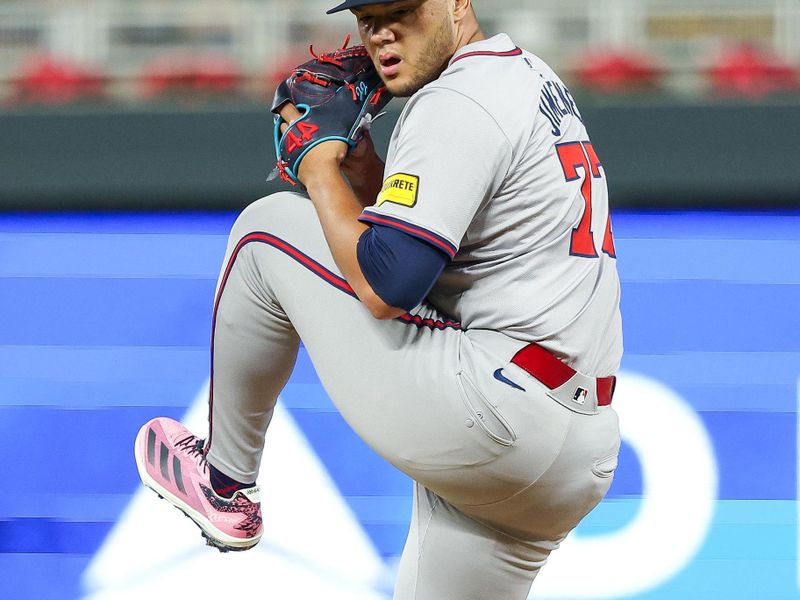 Aug 28, 2024; Minneapolis, Minnesota, USA; Atlanta Braves pitcher Joe Jimenez (77) delivers a pitch against the Minnesota Twins during the eighth inning at Target Field. Mandatory Credit: Matt Krohn-USA TODAY Sports