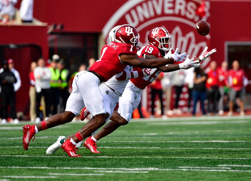 Oct 16, 2021; Bloomington, Indiana, USA; Indiana Hoosiers defensive back Josh Sanguinetti (19) intercepts a ball meant for Michigan State Spartans wide receiver Tre Mosley (17) during the second half at Memorial Stadium. Spartans win 20-15.  Mandatory Credit: Marc Lebryk-USA TODAY Sports