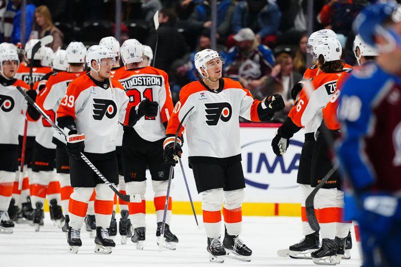 Jan 23, 2026; Denver, Colorado, USA; Members of the Philadelphia Flyers celebrate defeating the Colorado Avalanche at Ball Arena. Mandatory Credit: Ron Chenoy-Imagn Images