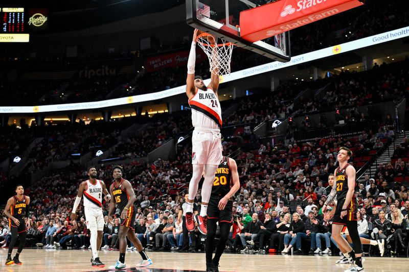 PORTLAND, OREGON - MARCH 13: Justin Minaya #24 of the Portland Trail Blazers dunks during the second quarter of the game against the Atlanta Hawks at the Moda Center on March 13, 2024 in Portland, Oregon. (Photo by Alika Jenner/Getty Images)