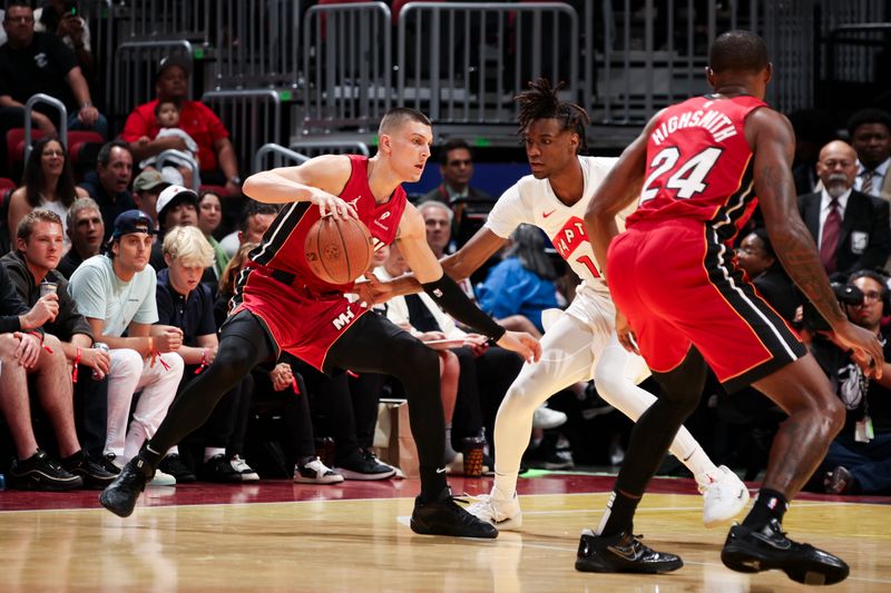 MIAMI, FL - NOVEMBER 29: Tyler Herro #14 of the Miami Heat dribbles the ball during the game against the Toronto Raptors in the NBA Cup on November 29, 2024 at Kaseya Center in Miami, Florida. NOTE TO USER: User expressly acknowledges and agrees that, by downloading and or using this Photograph, user is consenting to the terms and conditions of the Getty Images License Agreement. Mandatory Copyright Notice: Copyright 2024 NBAE (Photo by Issac Baldizon/NBAE via Getty Images)