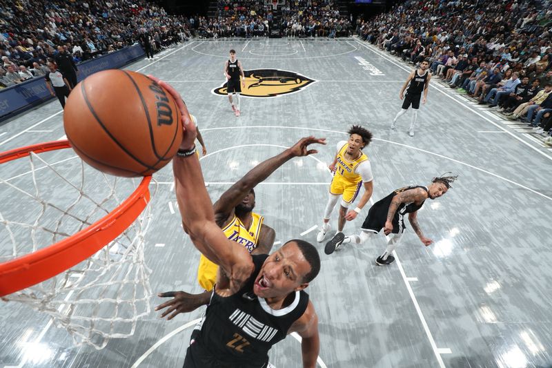 MEMPHIS, TN - MARCH 27: Desmond Bane #22 of the Memphis Grizzlies dunks the ball during the game against the Los Angeles Lakers on March 27, 2024 at FedExForum in Memphis, Tennessee. NOTE TO USER: User expressly acknowledges and agrees that, by downloading and or using this photograph, User is consenting to the terms and conditions of the Getty Images License Agreement. Mandatory Copyright Notice: Copyright 2024 NBAE (Photo by Joe Murphy/NBAE via Getty Images)