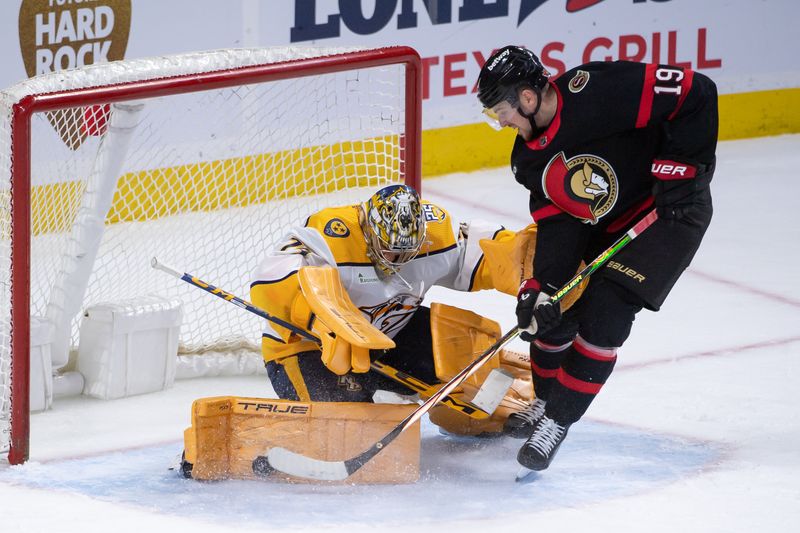 Jan 29, 2024; Ottawa, Ontario, CAN; Nashville Predators goalie Juuse Saros (74) makes a save on a shot from Ottawa Senators right wing Drake Batherson (19) in the third period at the Canadian Tire Centre. Mandatory Credit: Marc DesRosiers-USA TODAY Sports