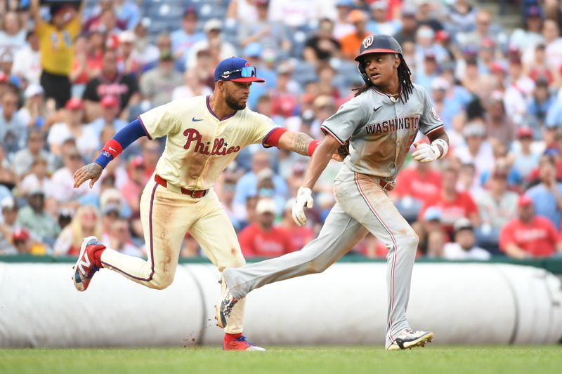 Aug 18, 2024; Philadelphia, Pennsylvania, USA;  Philadelphia Phillies shortstop Edmundo Sosa (33) tags out Washington Nationals shortstop CJ Abrams (5) in a rundown after he picked off during the third inning at Citizens Bank Park. Mandatory Credit: Eric Hartline-USA TODAY Sports