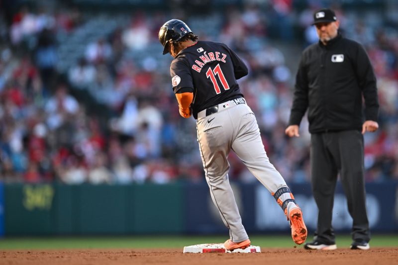 May 25, 2024; Anaheim, California, USA; Cleveland Guardians third baseman Jose Ramirez (11) runs the bases after hitting a two-run home run against the Los Angeles Angels during the third inning at Angel Stadium. Mandatory Credit: Jonathan Hui-USA TODAY Sports
