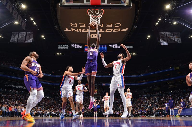 PHOENIX, AZ - FEBRUARY 14:  Bol Bol #11 of the Phoenix Suns drives to the basket during the game against the Detroit Pistons on February 14, 2024 at Footprint Center in Phoenix, Arizona. NOTE TO USER: User expressly acknowledges and agrees that, by downloading and or using this photograph, user is consenting to the terms and conditions of the Getty Images License Agreement. Mandatory Copyright Notice: Copyright 2024 NBAE (Photo by Barry Gossage/NBAE via Getty Images)