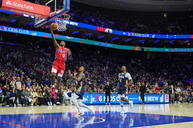 PHILADELPHIA, PENNSYLVANIA - JANUARY 10: Tyrese Maxey #0 of the Philadelphia 76ers shoots the ball against Dejounte Murray #5 of the New Orleans Pelicans in the second half at the Wells Fargo Center on January 10, 2025 in Philadelphia, Pennsylvania. The Pelicans defeated the 76ers 123-115. NOTE TO USER: User expressly acknowledges and agrees that, by downloading and/or using this photograph, user is consenting to the terms and conditions of the Getty Images License Agreement. (Photo by Mitchell Leff/Getty Images)