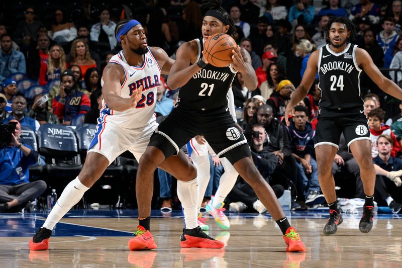 PHILADELPHIA, PA - OCTOBER 16:  Noah Clowney #21 of the Brooklyn Nets dribbles the ball during the game against the Philadelphia 76ers on October 16, 2024 at the Wells Fargo Center in Philadelphia, Pennsylvania NOTE TO USER: User expressly acknowledges and agrees that, by downloading and/or using this Photograph, user is consenting to the terms and conditions of the Getty Images License Agreement. Mandatory Copyright Notice: Copyright 2024 NBAE (Photo by David Dow/NBAE via Getty Images)