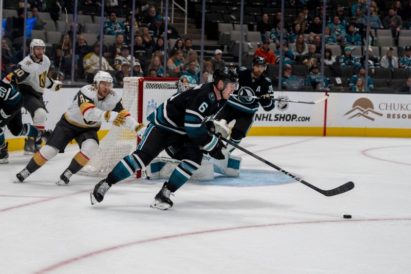 Feb 19, 2024; San Jose, California, USA; San Jose Sharks defenseman Ty Emberson (6) starts a fast break against Vegas Golden Knights right wing Jonathan Marchessault (81) during the third period at SAP Center at San Jose. Mandatory Credit: Neville E. Guard-USA TODAY Sports