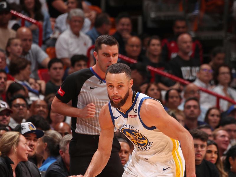 MIAMI, FL - MARCH 26: Stephen Curry #30 of the Golden State Warriors dribbles the ball during the game against the Miami Heat on March 26, 2024 at Kaseya Center in Miami, Florida. NOTE TO USER: User expressly acknowledges and agrees that, by downloading and or using this Photograph, user is consenting to the terms and conditions of the Getty Images License Agreement. Mandatory Copyright Notice: Copyright 2024 NBAE (Photo by Issac Baldizon/NBAE via Getty Images)