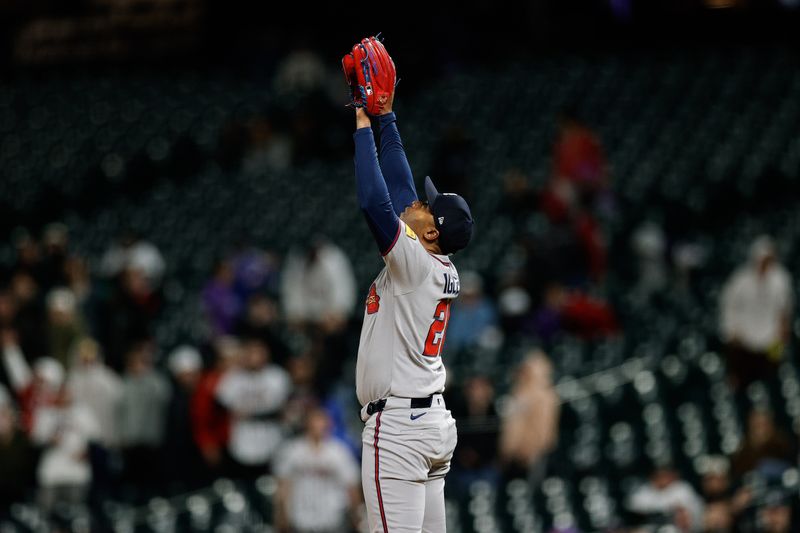 Apr 28, 2025; Denver, Colorado, USA; Atlanta Braves relief pitcher Raisel Iglesias (26) reacts after the game against the Colorado Rockies at Coors Field. Mandatory Credit: Isaiah J. Downing-Imagn Images