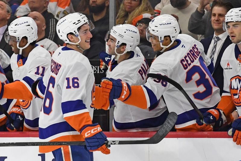 Jan 30, 2025; Philadelphia, Pennsylvania, USA; New York Islanders center Marc Gatcomb (16) celebrates his goal with teammates against the Philadelphia Flyers during the second period at Wells Fargo Center. Mandatory Credit: Eric Hartline-Imagn Images