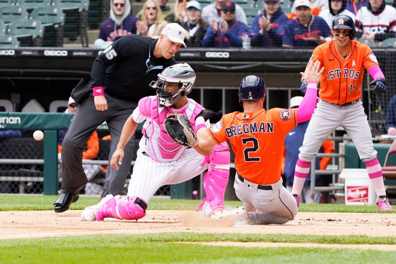 May 14, 2023; Chicago, Illinois, USA; Houston Astros third baseman Alex Bregman (2) is safe at home plate as Chicago White Sox catcher Seby Zavala (44) takes a late throw during the first inning at Guaranteed Rate Field. Mandatory Credit: David Banks-USA TODAY Sports