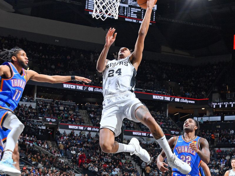 SAN ANTONIO, TX - FEBRUARY 29: Devin Vassell #24 of the San Antonio Spurs shoots the ball during the game against the Oklahoma City Thunder on February 29, 2024 at the Frost Bank Center in San Antonio, Texas. NOTE TO USER: User expressly acknowledges and agrees that, by downloading and or using this photograph, user is consenting to the terms and conditions of the Getty Images License Agreement. Mandatory Copyright Notice: Copyright 2024 NBAE (Photos by Michael Gonzales/NBAE via Getty Images)