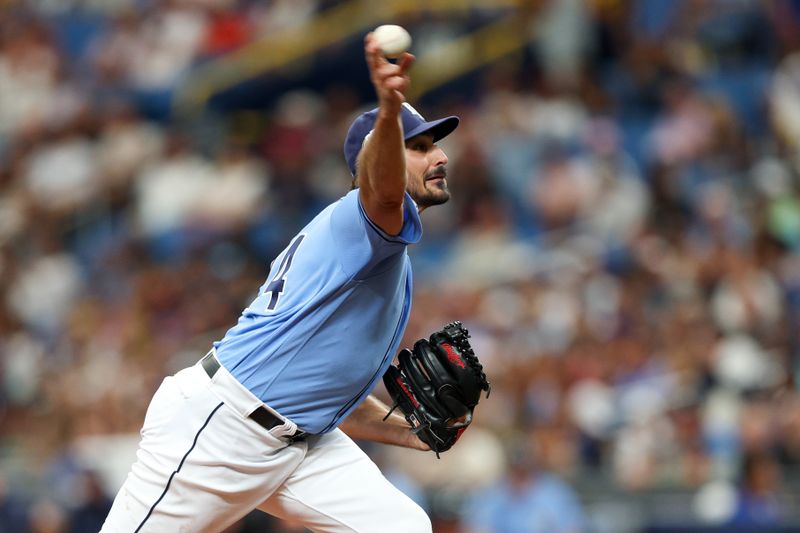 Jul 9, 2023; St. Petersburg, Florida, USA;   Tampa Bay Rays starting pitcher Zach Eflin (24) throws a pitch against the Atlanta Braves in the first inning at Tropicana Field. Mandatory Credit: Nathan Ray Seebeck-USA TODAY Sports