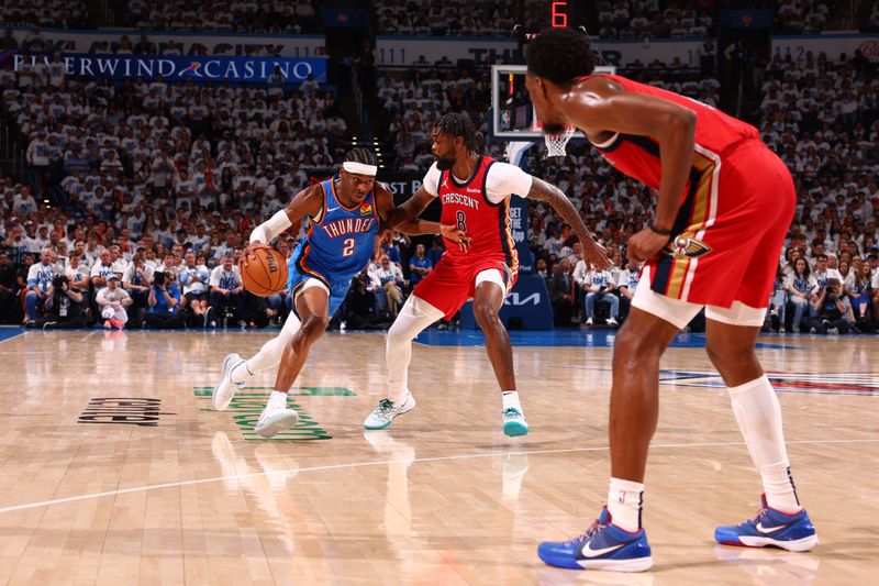 OKLAHOMA CITY, OK - APRIL 24: Shai Gilgeous-Alexander #2 of the Oklahoma City Thunder dribbles the ball during the game against the New Orleans Pelicans during Round 1 Game 2 of the 2024 NBA Playoffs on April 24, 2024 at Paycom Arena in Oklahoma City, Oklahoma. NOTE TO USER: User expressly acknowledges and agrees that, by downloading and or using this photograph, User is consenting to the terms and conditions of the Getty Images License Agreement. Mandatory Copyright Notice: Copyright 2024 NBAE (Photo by Zach Beeker/NBAE via Getty Images)