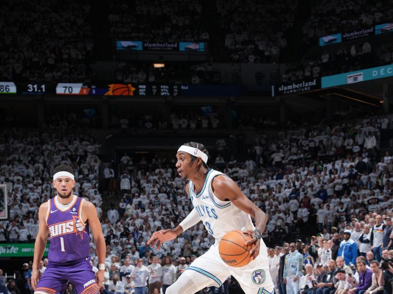 MINNEAPOLIS, MN -  APRIL 20: Jaden McDaniels #3 of the Minnesota Timberwolves drives to the basket during Round One Game One of the 2024 NBA Playoffs against the Phoenix Suns on April 20, 2024 at Target Center in Minneapolis, Minnesota. NOTE TO USER: User expressly acknowledges and agrees that, by downloading and or using this Photograph, user is consenting to the terms and conditions of the Getty Images License Agreement. Mandatory Copyright Notice: Copyright 2024 NBAE (Photo by Jordan Johnson/NBAE via Getty Images)