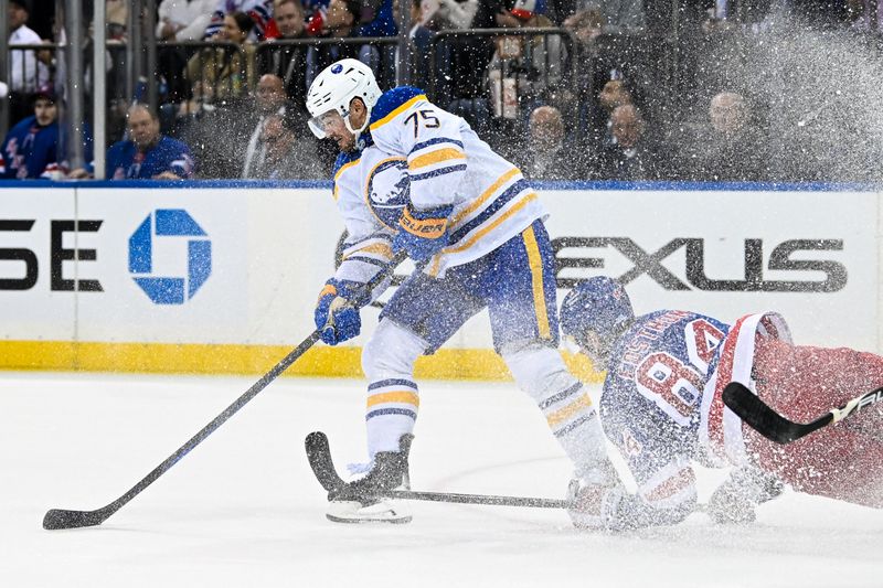 Nov 7, 2024; New York, New York, USA;  Buffalo Sabres defenseman Connor Clifton (75) steals the puck from New York Rangers center Adam Edstrom (84) during the second period at Madison Square Garden. Mandatory Credit: Dennis Schneidler-Imagn Images