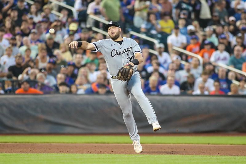 Jul 19, 2023; New York City, New York, USA;  Chicago White Sox third baseman Jake Burger (30) makes a running throw to first base in the fourth inning against the New York Mets at Citi Field. Mandatory Credit: Wendell Cruz-USA TODAY Sports