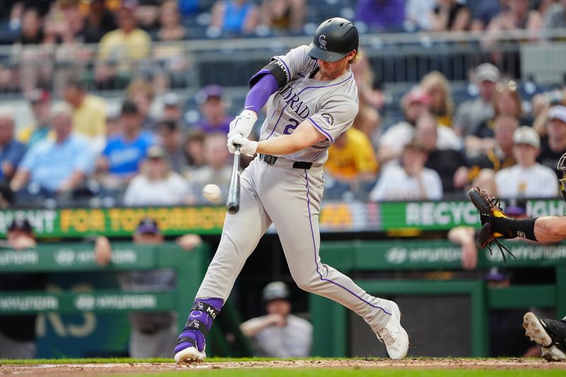 May 3, 2024; Pittsburgh, Pennsylvania, USA; Colorado Rockies shortstop Ezequiel Tovar (14) hits a single against the Pittsburgh Pirates during the third inning at PNC Park. Mandatory Credit: Gregory Fisher-USA TODAY Sports