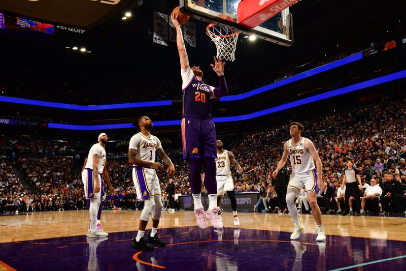 PHOENIX, AZ - FEBRUARY 25: Jusuf Nurkic #20 of the Phoenix Suns drives to the basket during the game against the Los Angeles Lakers on February 25, 2024 at Footprint Center in Phoenix, Arizona. NOTE TO USER: User expressly acknowledges and agrees that, by downloading and or using this photograph, user is consenting to the terms and conditions of the Getty Images License Agreement. Mandatory Copyright Notice: Copyright 2024 NBAE (Photo by Kate Frese/NBAE via Getty Images)