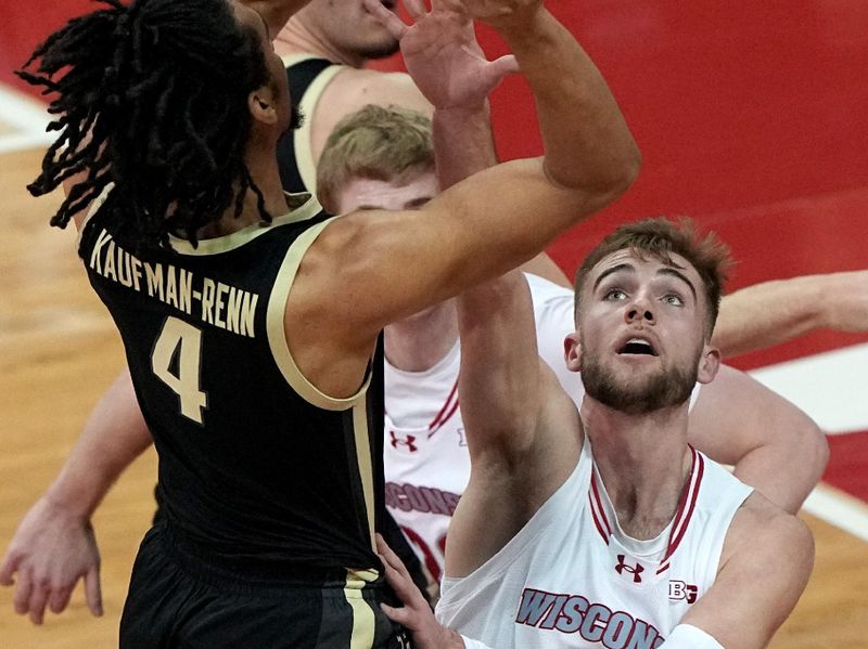 Feb 4, 2024; Madison, Wisconsin, USA; Purdue forward Trey Kaufman-Renn shoots over Wisconsin forward Tyler Wahl (5) during the first half at Kohl Center. Mandatory Credit: Mark Hoffman-USA TODAY Sports