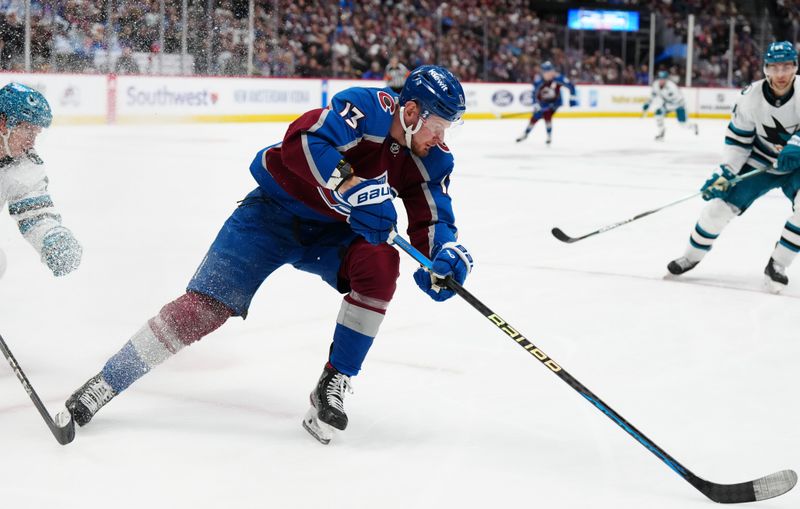 Dec 31, 2023; Denver, Colorado, USA; Colorado Avalanche right wing Valeri Nichushkin (13) controls the puck in the second period against the San Jose Sharks at Ball Arena. Mandatory Credit: Ron Chenoy-USA TODAY Sports