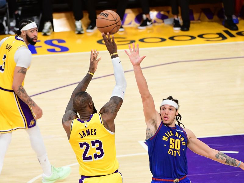 LOS ANGELES, CA - APRIL 25: LeBron James #23 of the Los Angeles Lakers shoots the ball during the game against the Denver Nuggets during Round One Game Three of the 2024 NBA Playoffs on April 25, 2024 at Crypto.Com Arena in Los Angeles, California. NOTE TO USER: User expressly acknowledges and agrees that, by downloading and/or using this Photograph, user is consenting to the terms and conditions of the Getty Images License Agreement. Mandatory Copyright Notice: Copyright 2024 NBAE (Photo by Adam Pantozzi/NBAE via Getty Images)