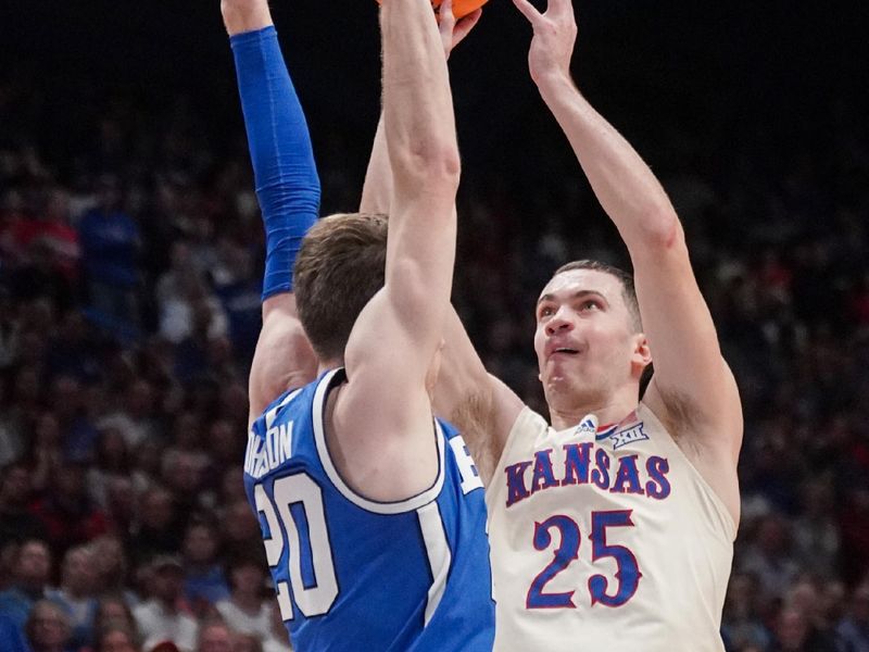 Feb 27, 2024; Lawrence, Kansas, USA; Kansas Jayhawks guard Nicolas Timberlake (25) shoots over Brigham Young Cougars guard Spencer Johnson (20) during the second half at Allen Fieldhouse. Mandatory Credit: Denny Medley-USA TODAY Sports