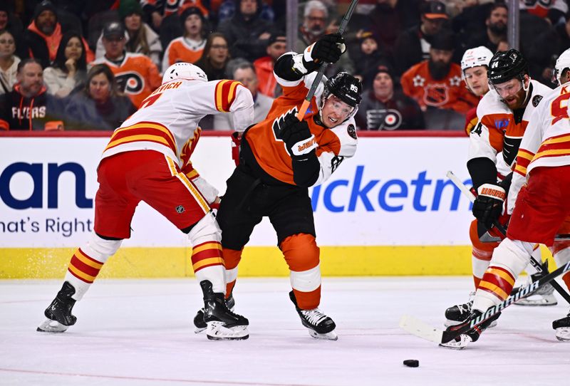 Jan 6, 2024; Philadelphia, Pennsylvania, USA; Philadelphia Flyers right wing Cam Atkinson (89) battles for the puck against Calgary Flames center Yegor Sharangovich (17) in the first period at Wells Fargo Center. Mandatory Credit: Kyle Ross-USA TODAY Sports