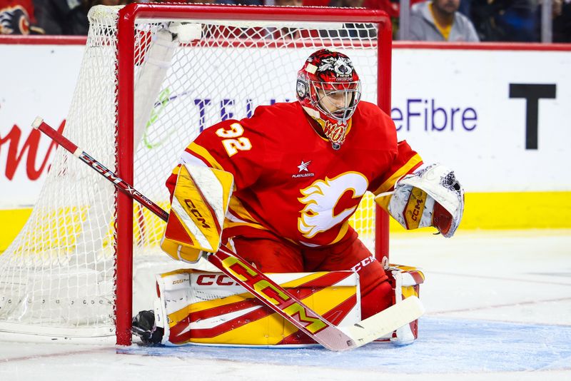 Oct 15, 2024; Calgary, Alberta, CAN; Calgary Flames goaltender Dustin Wolf (32) guards his net against the Chicago Blackhawks during the first period at Scotiabank Saddledome. Mandatory Credit: Sergei Belski-Imagn Images