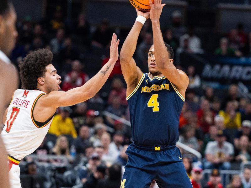 Mar 15, 2025; Indianapolis, IN, USA; Maryland Terrapins center Braden Pierce (4) shoots the ball while Maryland Terrapins guard Ja'Kobi Gillespie (0) defends in the first half at Gainbridge Fieldhouse. Mandatory Credit: Trevor Ruszkowski-Imagn Images