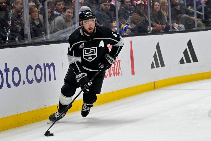 Mar 3, 2024; Los Angeles, California, USA;  Los Angeles Kings defenseman Drew Doughty (8) handles the puck in the first period against the New Jersey Devils at Crypto.com Arena. Mandatory Credit: Jayne Kamin-Oncea-USA TODAY Sports