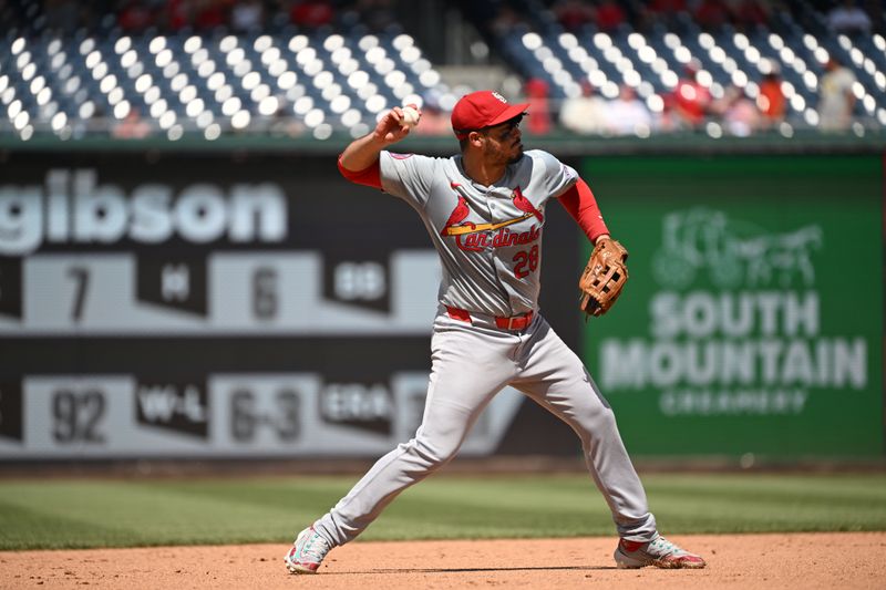 Jul 7, 2024; Washington, District of Columbia, USA; St. Louis Cardinals third baseman Nolan Arenado (28) prepares the throw to first base against the Washington Nationals during the fifth inning at Nationals Park. Mandatory Credit: Rafael Suanes-USA TODAY Sports