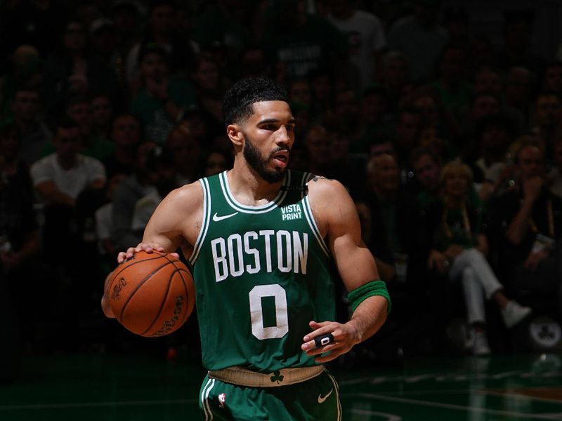 BOSTON, MA - JUNE 17: Jayson Tatum #0 of the Boston Celtics dribbles the ball during the game against the Dallas Mavericks during Game 5 of the 2024 NBA Finals on June 17, 2024 at the TD Garden in Boston, Massachusetts. NOTE TO USER: User expressly acknowledges and agrees that, by downloading and or using this photograph, User is consenting to the terms and conditions of the Getty Images License Agreement. Mandatory Copyright Notice: Copyright 2024 NBAE  (Photo by Garrett Ellwood/NBAE via Getty Images)
