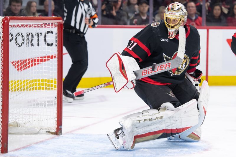 Feb 22, 2024; Ottawa, Ontario, CAN; Ottawa Senators goalie Anton Forsberg (31) tries to settle the puck in the second period against the Vegas Golden Knights at the Canadian Tire Centre. Mandatory Credit: Marc DesRosiers-USA TODAY Sports