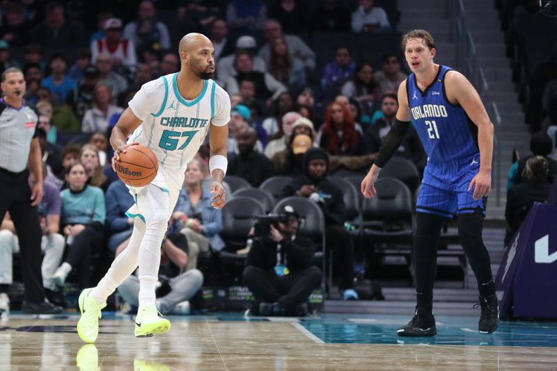 CHARLOTTE, NC -NOVEMBER 25: Taj Gibson #67 of the Charlotte Hornets dribbles the ball during the game against the Orlando Magic  on November 25, 2024 at Spectrum Center in Charlotte, North Carolina. NOTE TO USER: User expressly acknowledges and agrees that, by downloading and or using this photograph, User is consenting to the terms and conditions of the Getty Images License Agreement. Mandatory Copyright Notice: Copyright 2024 NBAE (Photo by Brock Williams-Smith/NBAE via Getty Images)