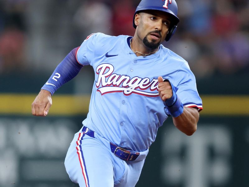 May 18, 2025; Arlington, Texas, USA; Texas Rangers second base Marcus Semien (2) runs to third base during the fourth inning against the Houston Astros at Globe Life Field. Mandatory Credit: Tim Heitman-Imagn Images