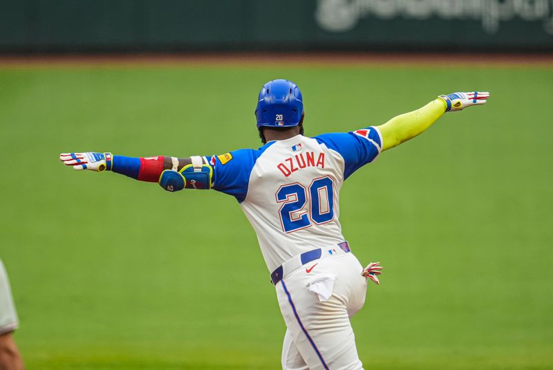 Jul 6, 2024; Cumberland, Georgia, USA; Atlanta Braves designated hitter Marcell Ozuna (20) reacts after hitting a home run against the Philadelphia Phillies during the first inning at Truist Park. Mandatory Credit: Dale Zanine-USA TODAY Sports