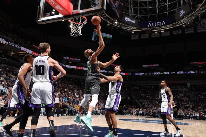 MINNEAPOLIS, MN -  MARCH 1: Rudy Gobert #27 of the Minnesota Timberwolves shoots the ball during the game against the Sacramento Kings on March 1, 2024 at Target Center in Minneapolis, Minnesota. NOTE TO USER: User expressly acknowledges and agrees that, by downloading and or using this Photograph, user is consenting to the terms and conditions of the Getty Images License Agreement. Mandatory Copyright Notice: Copyright 2024 NBAE (Photo by David Sherman/NBAE via Getty Images)